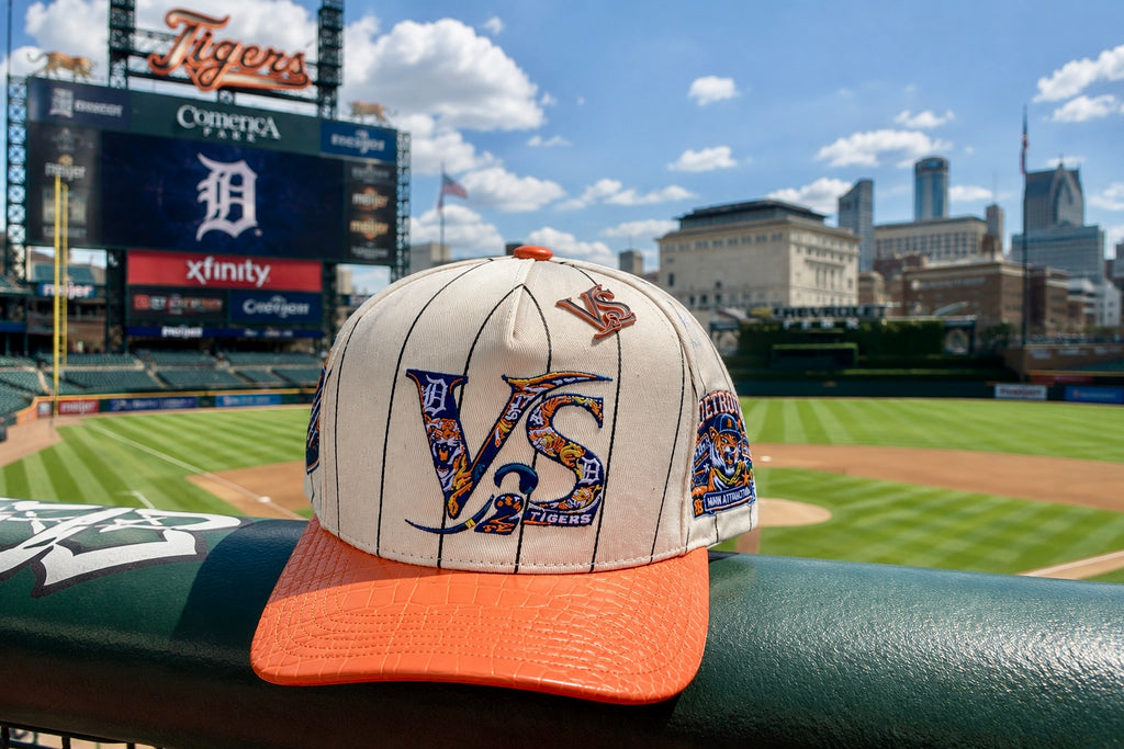 V-SQRD Detroit Diamond Premium Pinstripe Snapback – Orange Croc Edition The cream pinstripe body delivers a timeless classic look while the orange croc-textured brim creates a luxury finish that immediately grabs attention.

Combined with custom Detroit-i