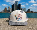 V-SQRD Detroit Legends Premium Leather Snapback – Cream Snakeskin Edition Premium cream leather snapback with gray snakeskin brim, custom Detroit-inspired embroidery, leather strap closure, and limited-edition V-SQRD detailing. Built for those who represe